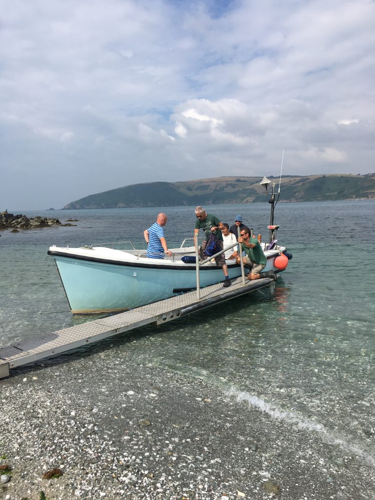 A group of people on a boat

Description automatically generated with medium confidence