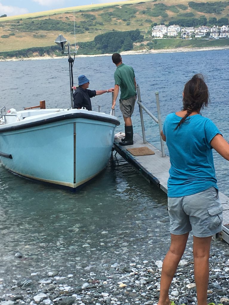 A group of people fishing

Description automatically generated with medium confidence